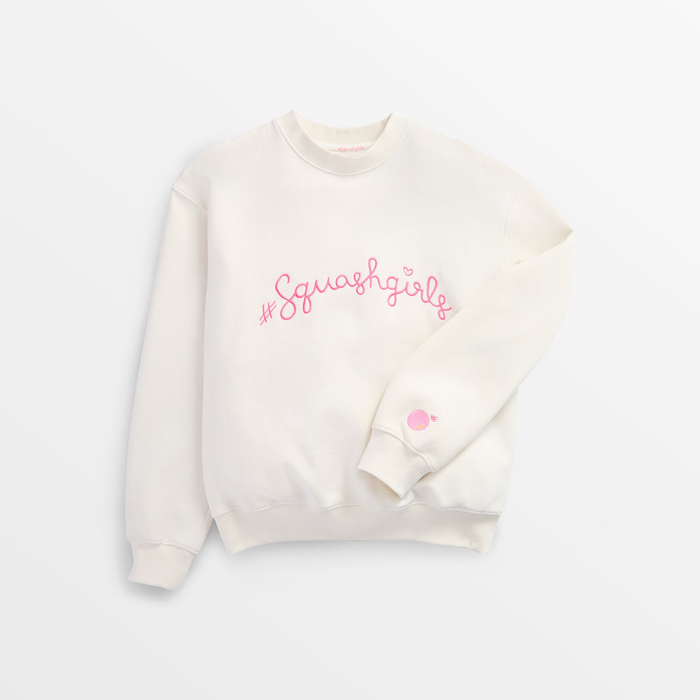 Beige sweatshirt with pink text on a white background