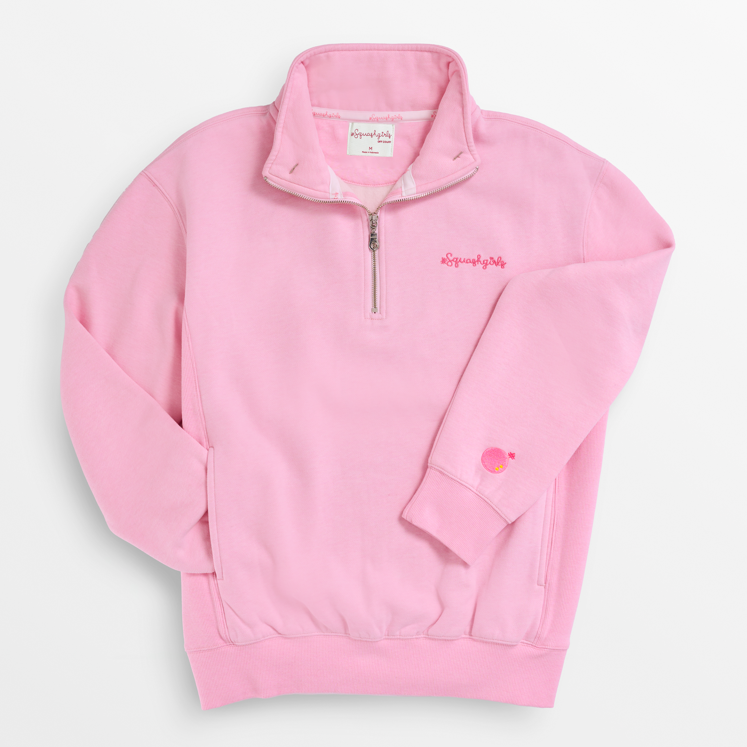 Pink pullover with a small logo on a light gray background