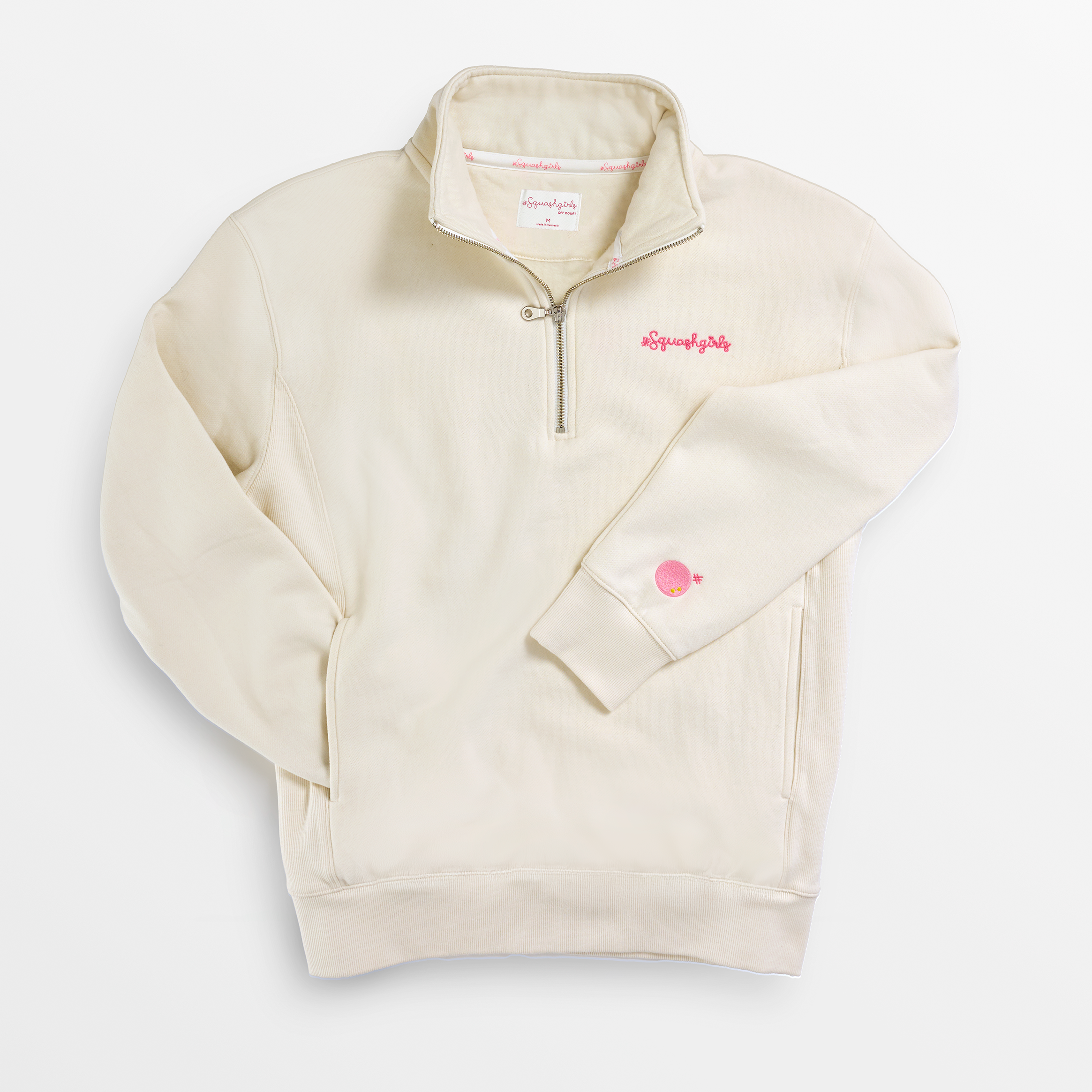 Beige pullover with a small logo on a white background